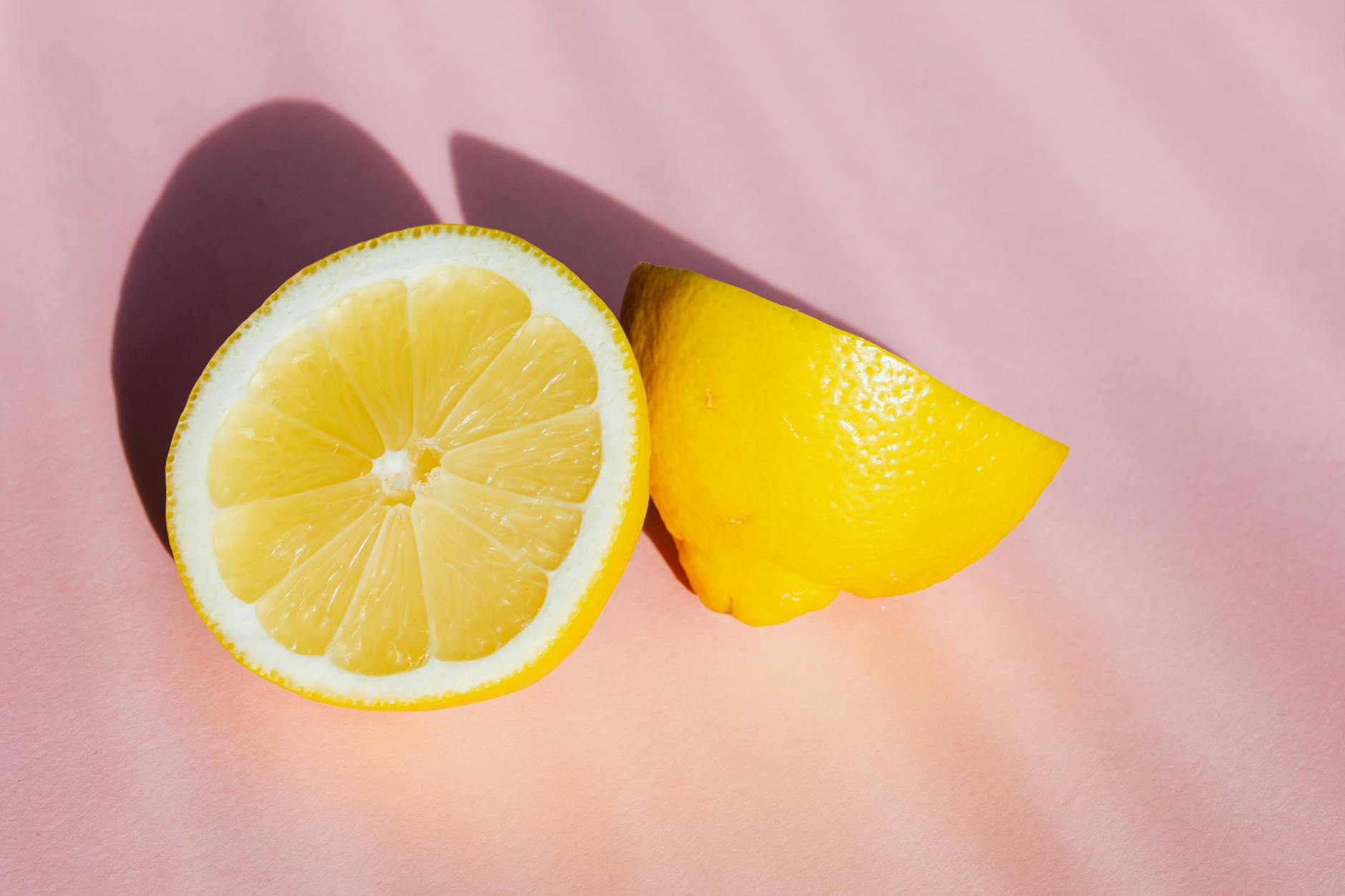 Colorful sex toys arranged on a bright yellow background, showcasing the design variety of clitoral vibrators